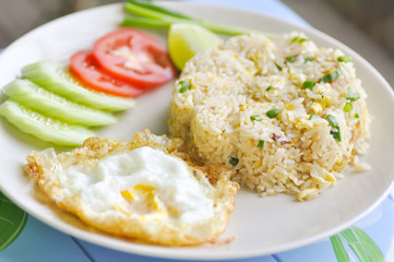 fried rice and fried egg with vegetable
