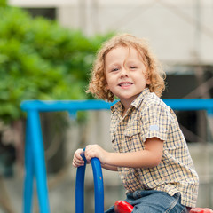 Happy little boy on the playground