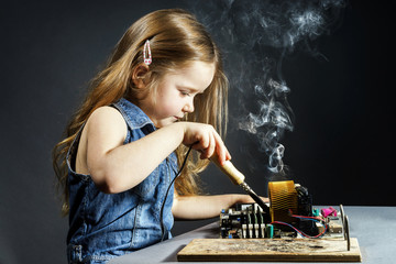 Cute little girl repair electronics by cooper-bit