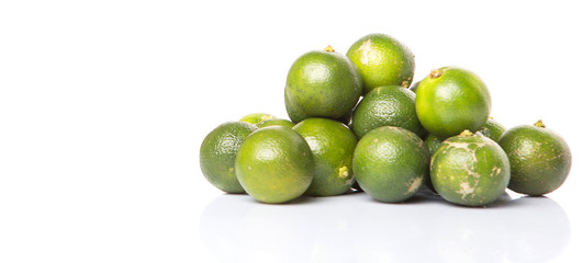 Calamondin or calamansi lime over white background