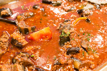 eggplant stewed in tomato sauce, close-up