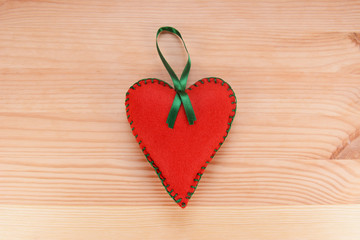 Red felt heart ornament with green ribbon