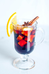 Hot red mulled wine isolated on white background