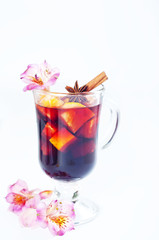flowers and mulled wine in glass