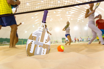 Beach tennis team workout on covered court