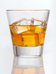 Glass of whiskey with ice