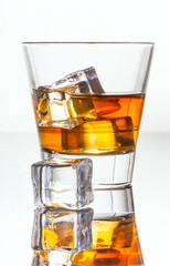 Glass of whiskey with ice