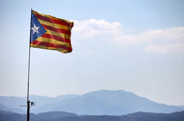 Catalan flag  blowing in the wind on blue sky
