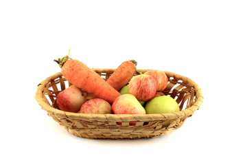 Basket with vegetables and fruits. Isolated object on white back