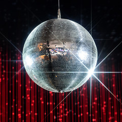 Silver disco ball with stars in nightclub