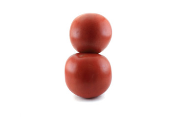 Two red ripe tomatoes. Isolated object on white background.