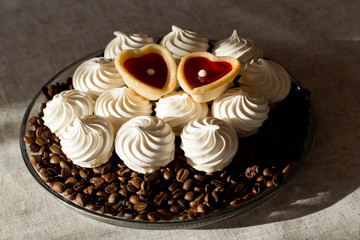 French vanilla meringue cookies and two sweet hearts