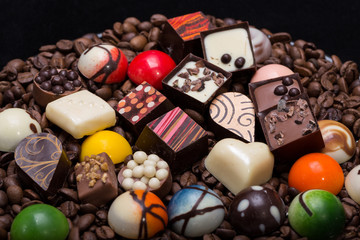 Set of a various chocolate pralines and coffee beans