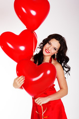 Fototapeta na wymiar Sexy brunette with balloons heart