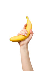 Women's hand with banana isolated on white background © nickshot