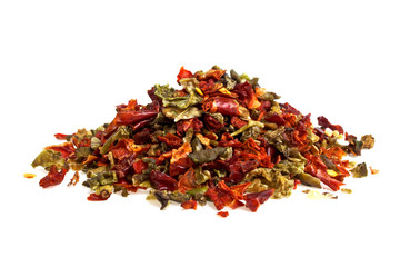 Mixture of dry peppers on a white background