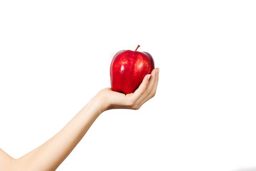 Woman's hand holding and showing a  apple on white background