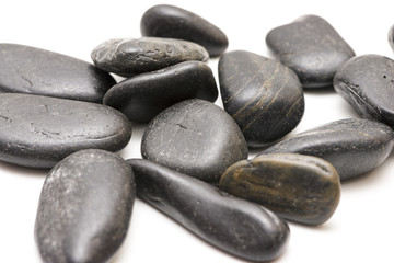 black stones on a white background