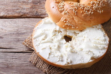 bagel with cream cheese close-up op view of the horizontal