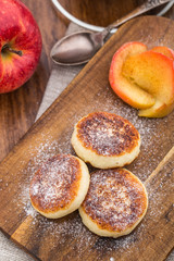 Cheese pancakes with baked apples