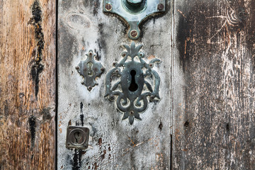 Keyhole over aged gray and brown old wood