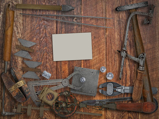 vintage jeweler tools,diamonds,business card over wooden wall