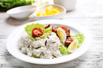 Boiled rice served on table, close-up