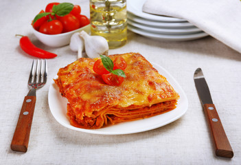 Portion of tasty lasagna on table