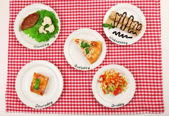 Daily menu. Plates with food on table