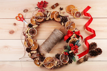 Christmas wreath with materials for decorating