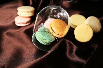 Gentle colorful macaroons in wine glass
