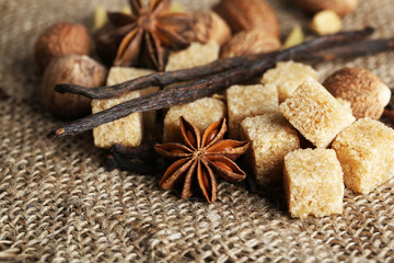 Christmas spices and baking ingredients on sackcloth background