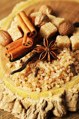 Christmas spices and baking ingredients on wooden background