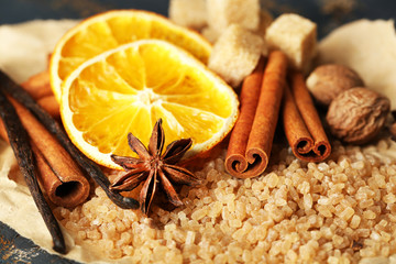 Christmas spices and baking ingredients on wooden background