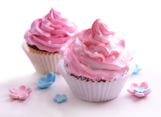 Delicious cupcakes isolated on white