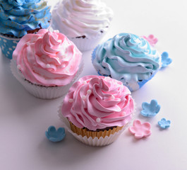 Delicious cupcakes isolated on white