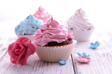 Delicious cupcakes on table close-up