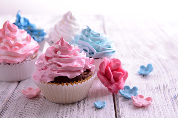 Delicious cupcakes on table close-up