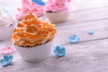 Delicious cupcakes on table close-up