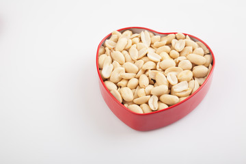 Peeled peanuts  in heart shape box
