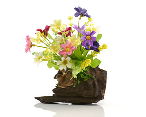 artificial flowers on timber