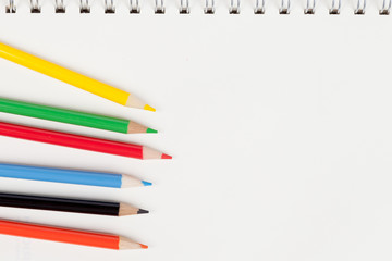 Color pencils on blank notebook