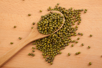 Mung beans with wooden spoon