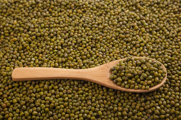 Mung beans with wooden spoon