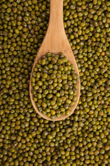 Mung beans with wooden spoon