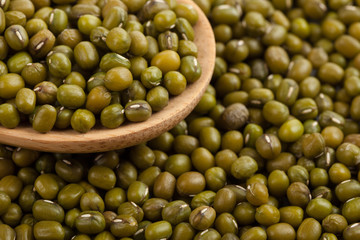 Mung beans with wooden spoon