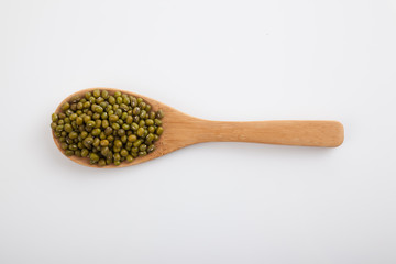 Mung beans with wooden spoon