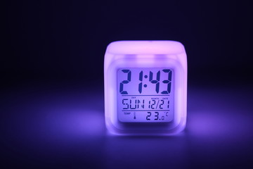 Clocks  with colored lighting at the night.