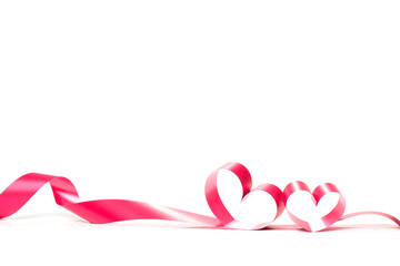 Ribbons shaped as hearts on white