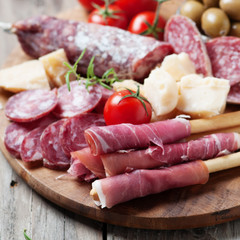 Traditional italian antipasto with prosciutto, cheese